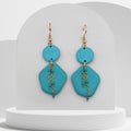 Turquoise polymer clay geometric drop earrings with gold chain detail and gold hooks