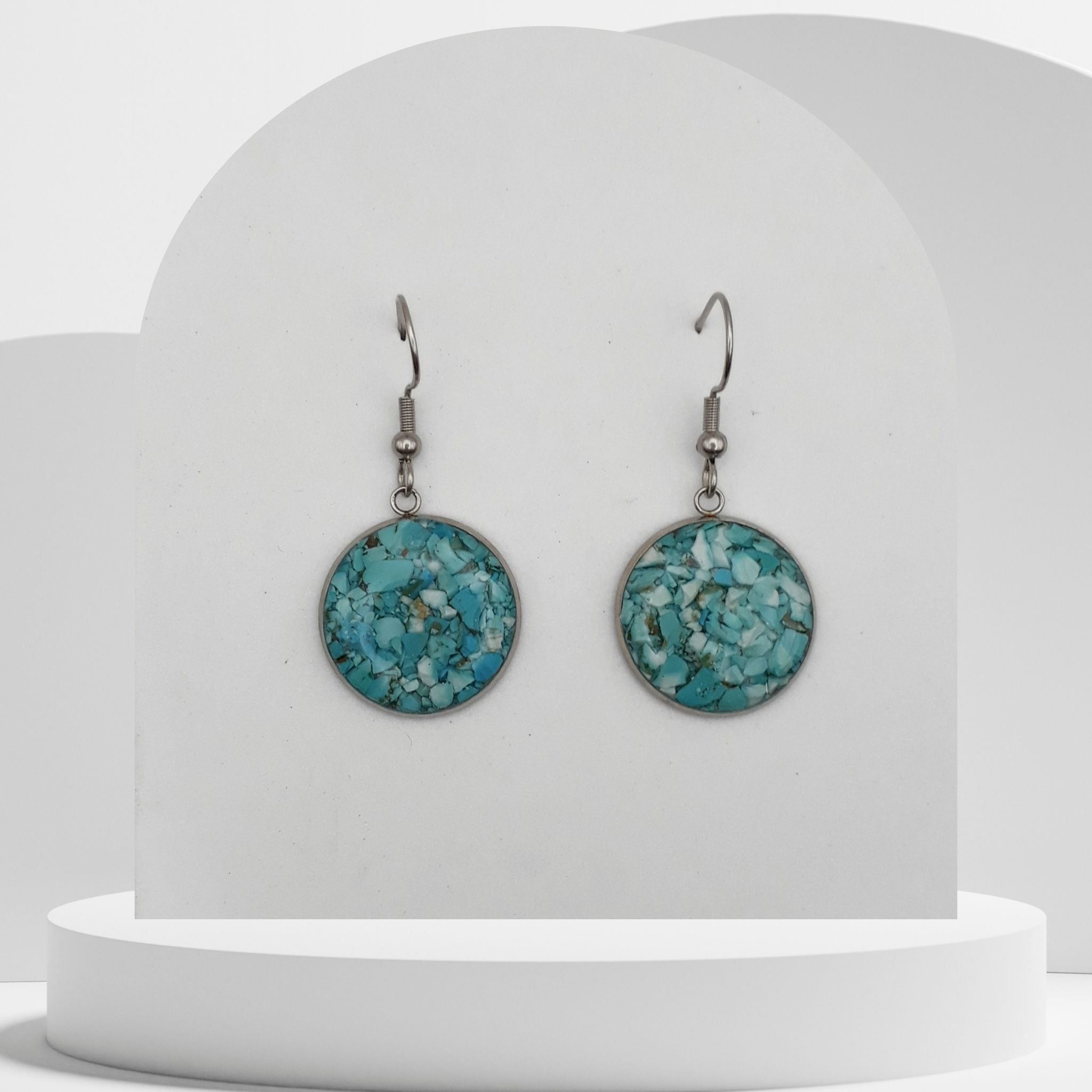 Stainless steel drop earrings with 18mm bezel set crushed turquoise gemstones sealed in glass-like resin on shepherd hooks