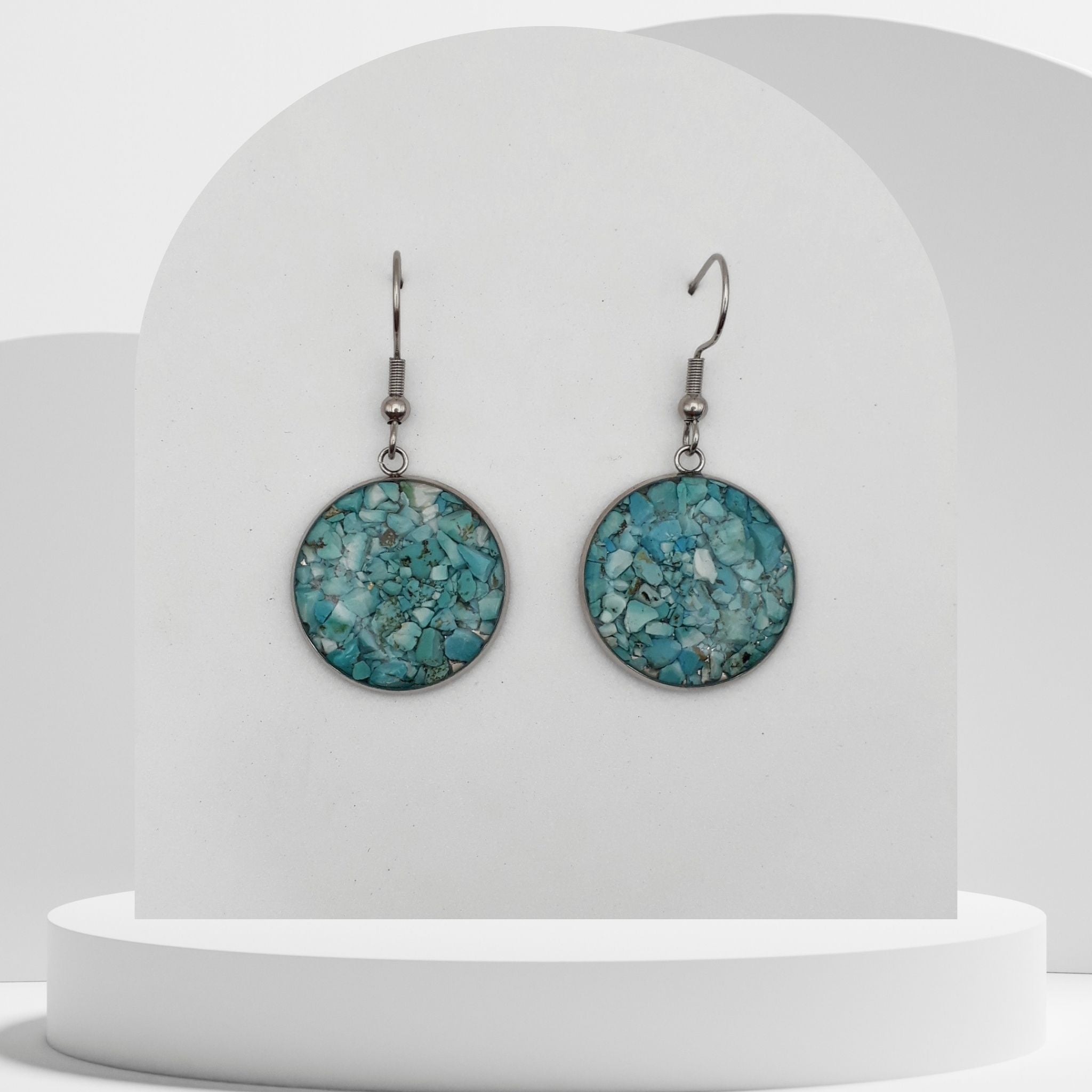 Stainless steel drop earrings with 20mm bezel set crushed turquoise gemstones sealed in glass-like resin on shepherd hooks