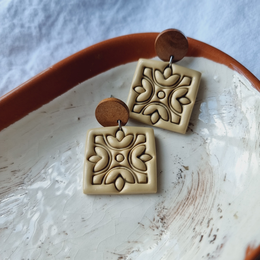 Experience love in every detail with our unique handmade square embossed polymer clay drop earrings. Adorned in a stunning earthy color
