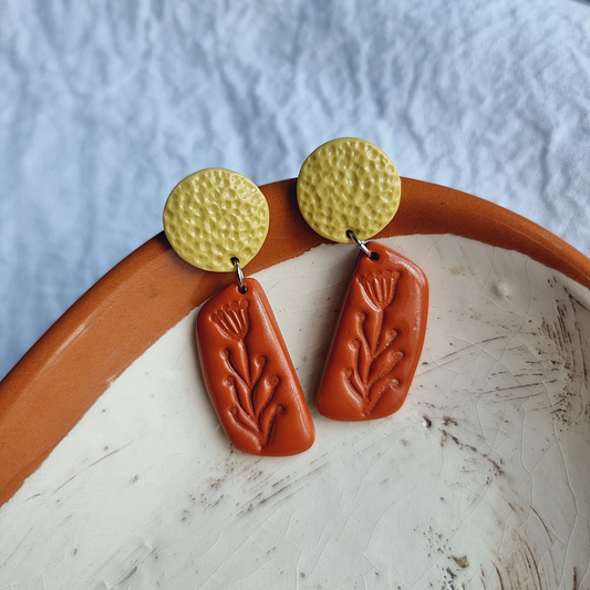 Elevate your style with our stunning handmade polymer clay earrings. Embrace earthy tones with a touch of sophistication