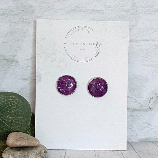 Raw Amethyst ear studs, measuring 12 mm in diameter, offer a touch of natural elegance to your jewelry collection. 