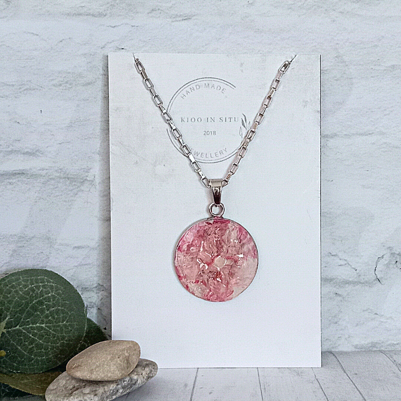 This Gorgeous Clear Quartz Necklace is made from natural Clear Quartz stone set on a Pink and White background. Unique Hand Crafted.