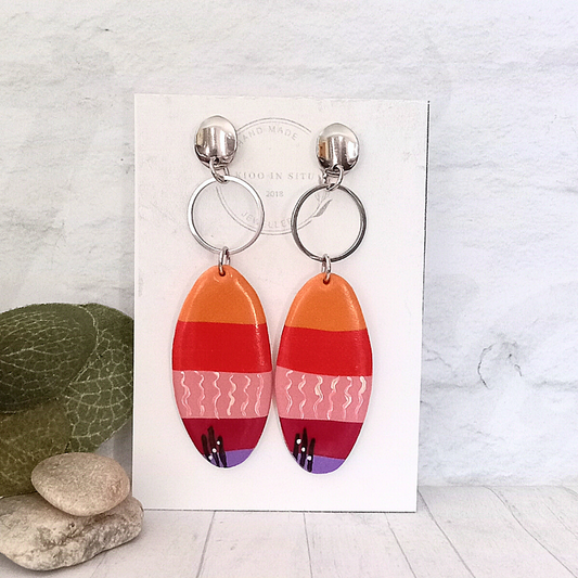 Introducing our vibrant Multi-Color Oval Polymer Clay Earrings, the perfect blend of artistry and comfort!