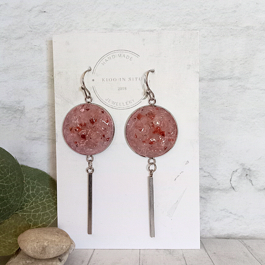 These unique handmade earrings feature raw natural strawberry obsidian set in 20 mm stainless steel rounds