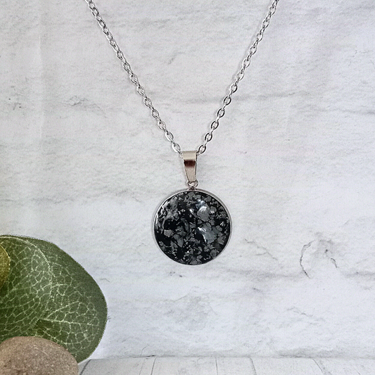 Behold the beauty of this Snowflake Obsidian Necklace, handmade with raw gemstones and crafted from stainless steel.