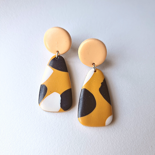 Introducing our exquisite handmade polymer clay earrings, available in stunning black, white, and caramel colors. 