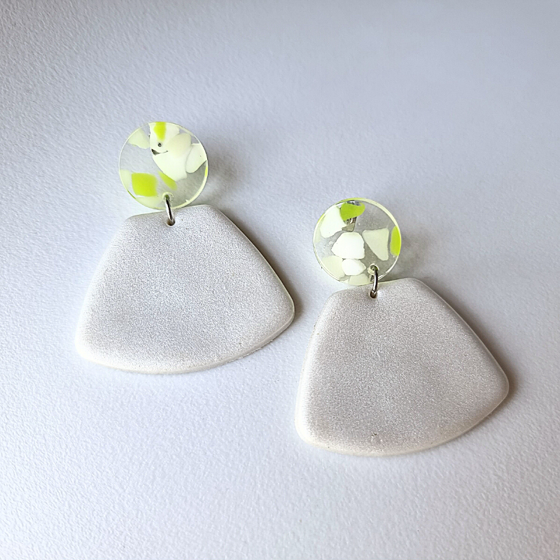 Look chic and stylish with these handmade white satin polymer clay earrings! Adorned with round lime green and white Perspex ear studs