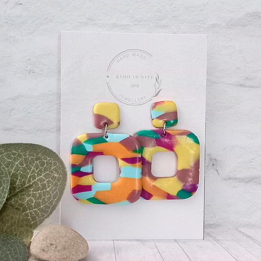 Put a spark of flair and funk into your everyday look with these Polymer Caly Earrings. Crafted with an array of colors