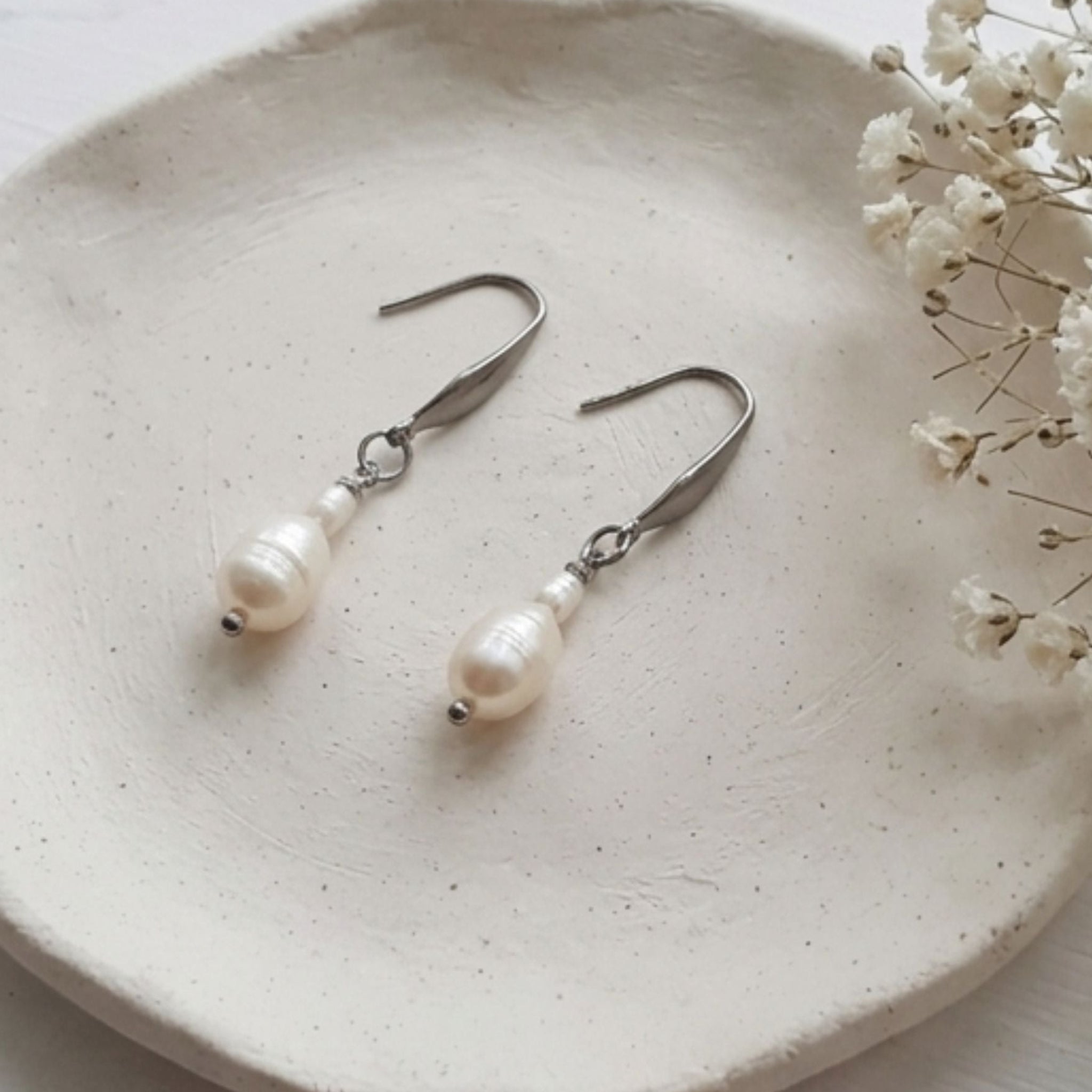 White natural freshwater pearl drop earrings with 7mm pear-shaped pearls and 304 stainless steel hooks