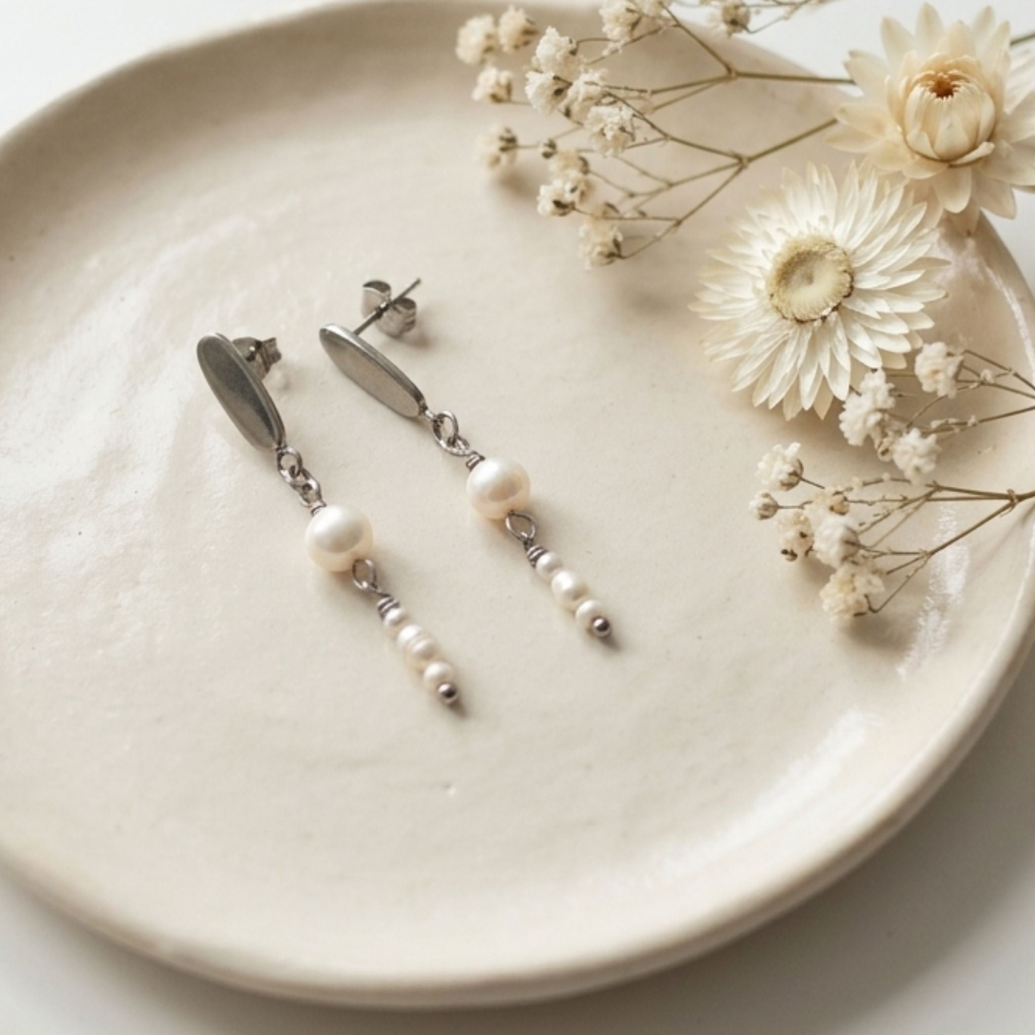White freshwater pearl drop earrings with 5mm natural pearl, three rice pearls and 304 stainless steel oval studs