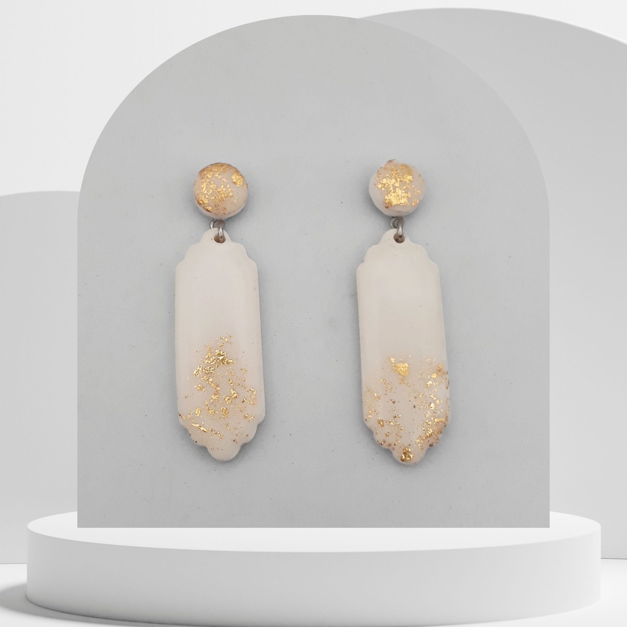 White polymer clay drop earrings with gold leaf and round stud tops