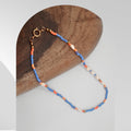 Handmade freshwater pearl necklace with blue and orange glass beads