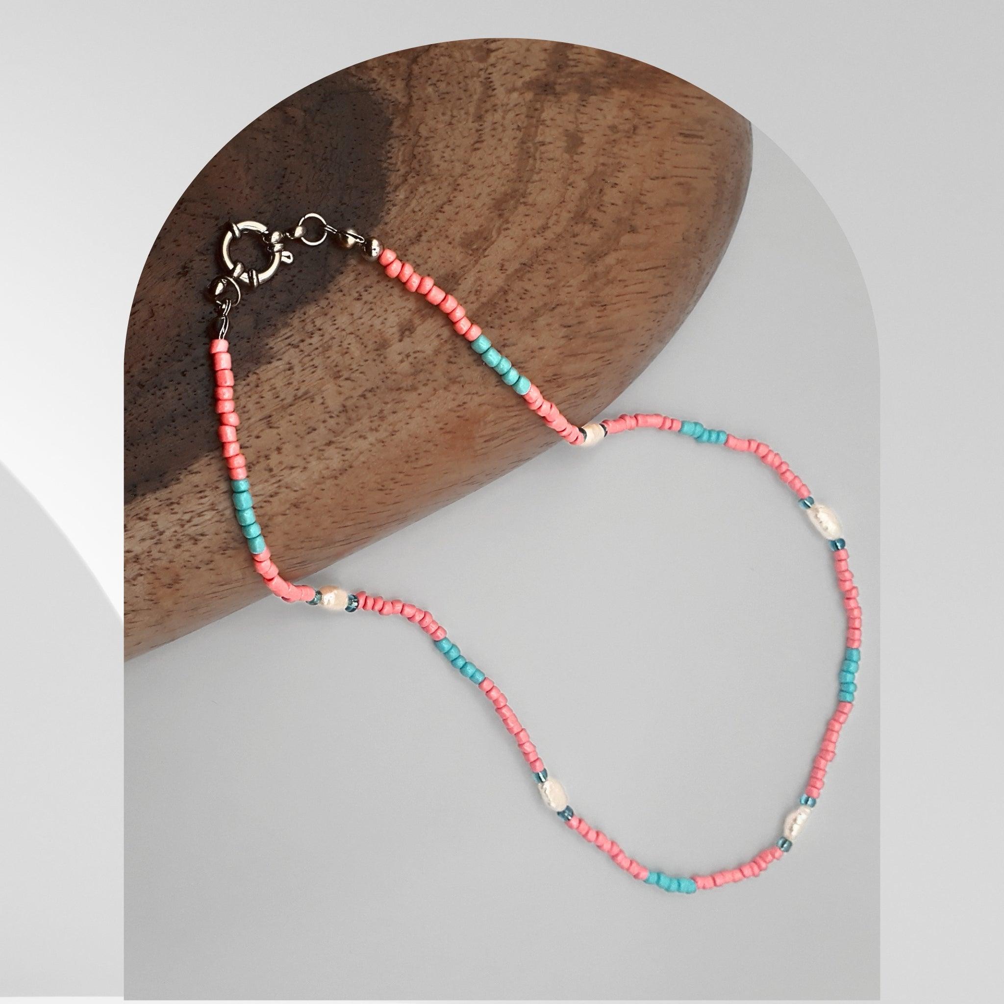 Handmade white freshwater pearl necklace with pastel pink and blue glass beads