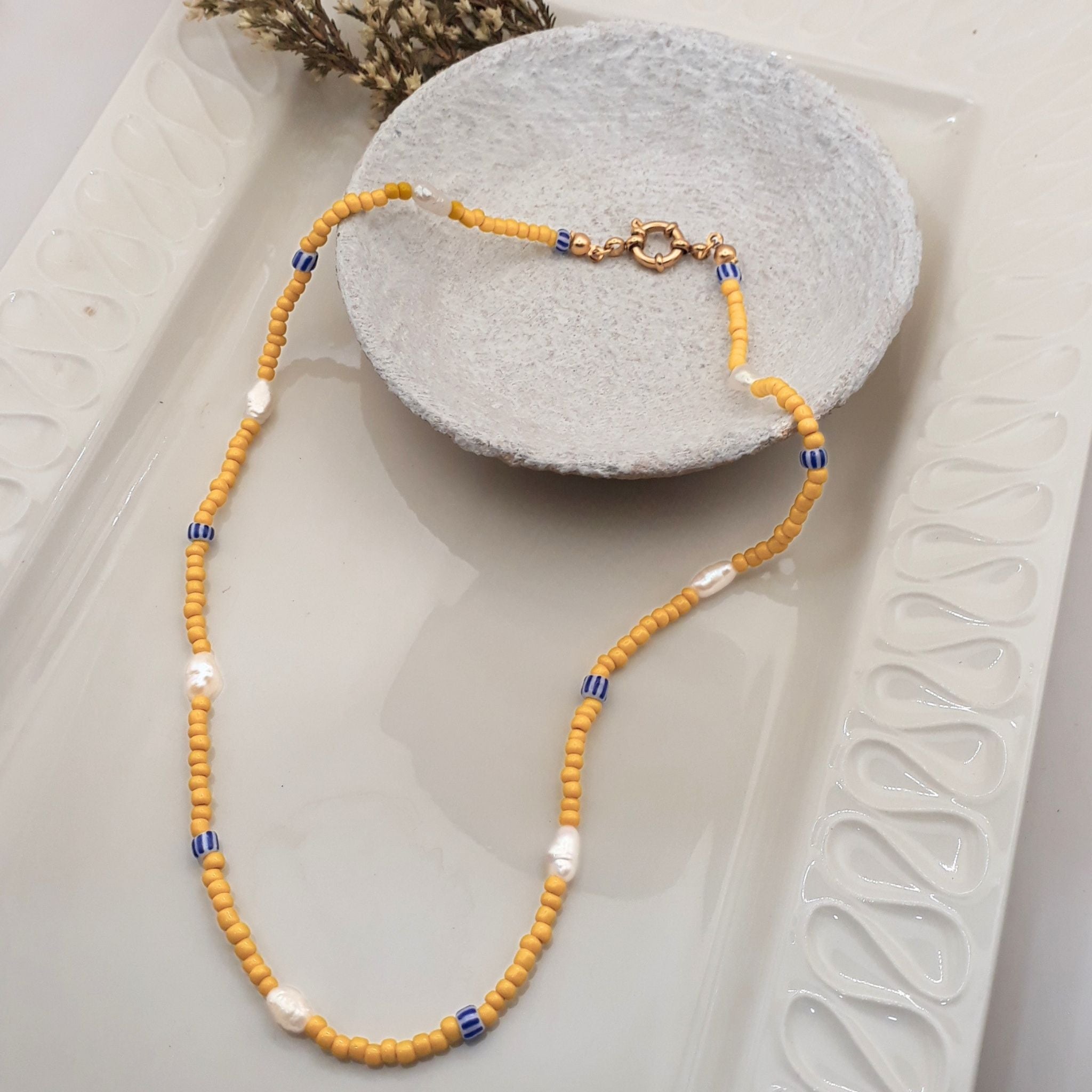 Handmade yellow glass bead necklace with seven natural white rice pearls and blue ceramic beads