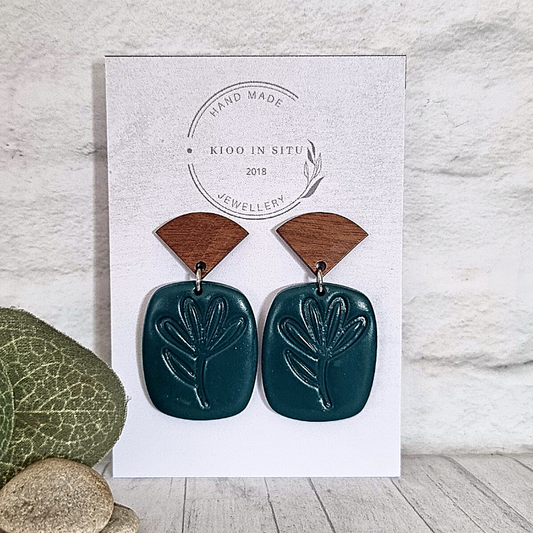Handcrafted with exquisite attention to detail, these polymer clay earrings feature a jade green hue exquisitely embossed with leaf pattern.