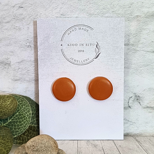 Our handmade, 15mm round Polymer Clay Ear Studs will add a touch of color to your look in a tan hue!